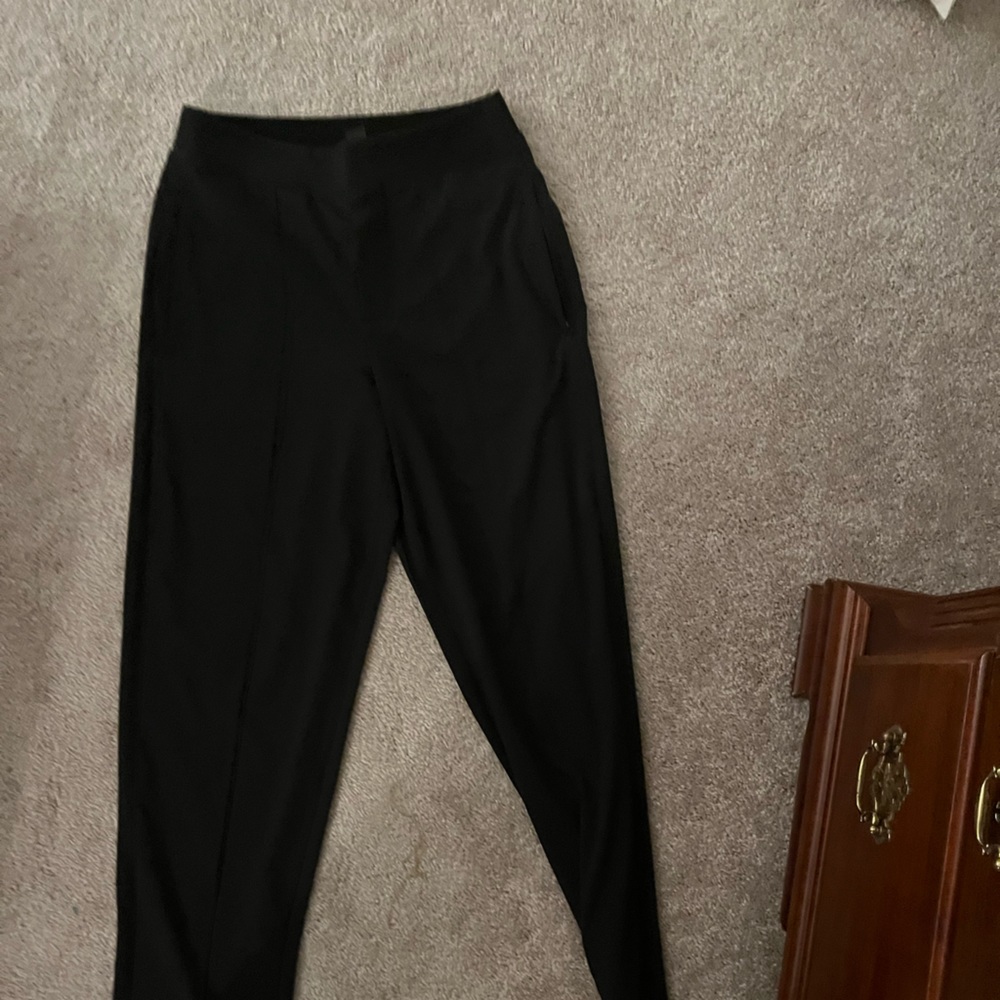 Athleta black pants. Mid waist. Elastic band soft pants. Never worn